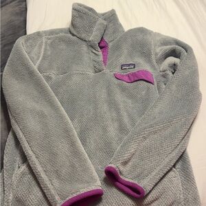 Women’s size small grey and purple Patagonia pull over.
